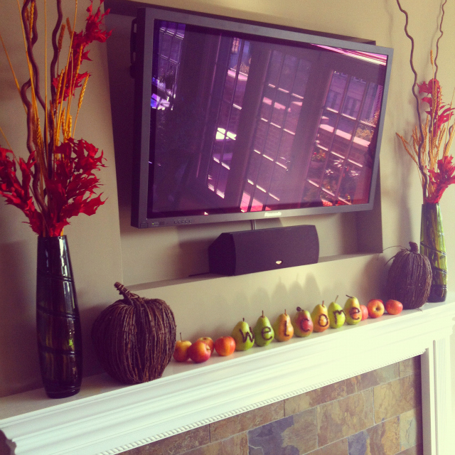 Fall fresh fruit fireplace mantel decor Pear and clove welcome sign