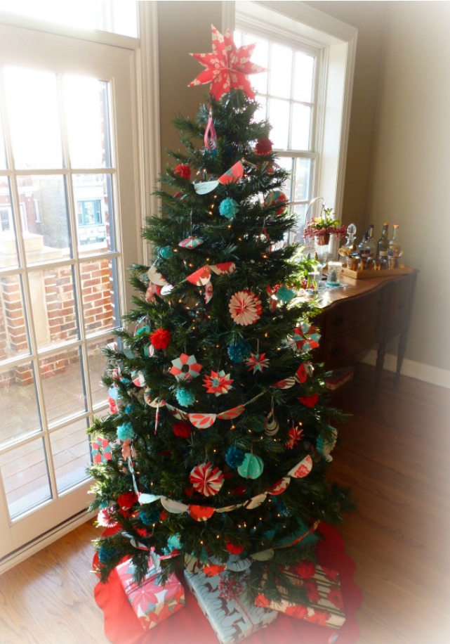 Christmas tree filled with paper ornaments