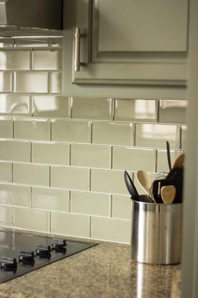 Green-gray subway tile blacksplash