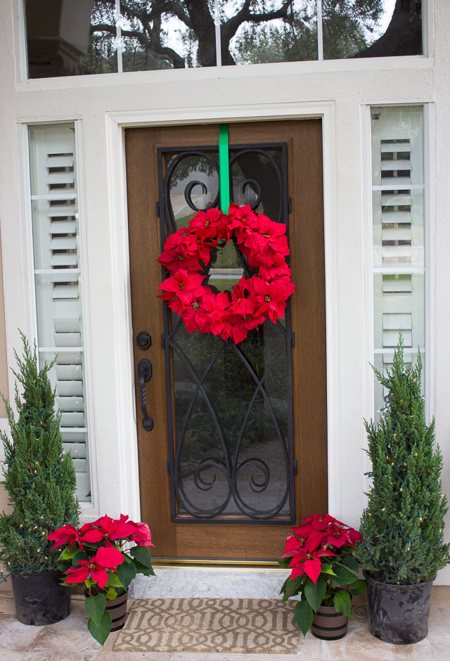 Poinsettia wreath on front door