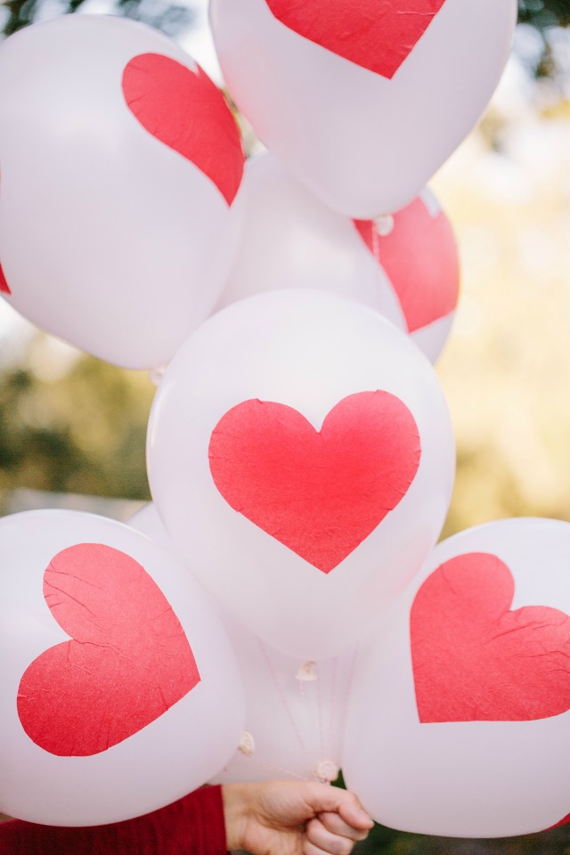 Make these DIY Valentine's Day heart balloons with Mod Podge and tissue paper!