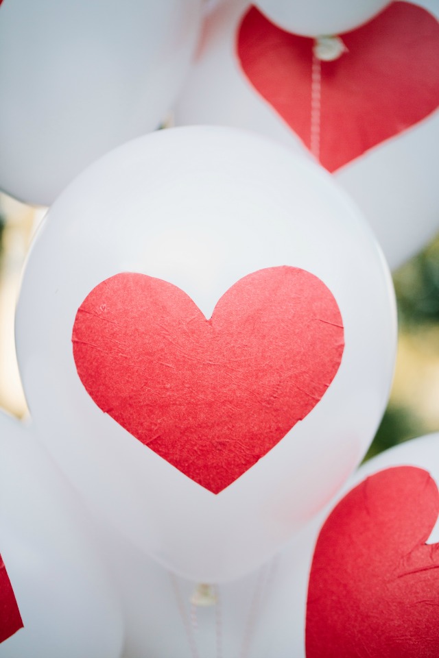 Make these DIY Valentine's Day heart balloons with Mod Podge and tissue paper!