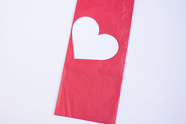 Make these DIY Valentine's Day heart balloons with Mod Podge and tissue paper!