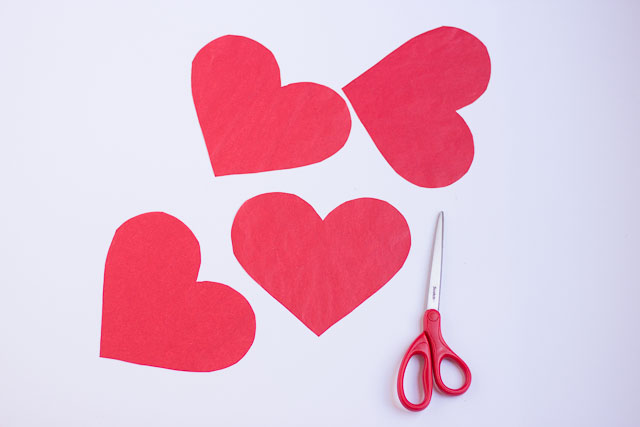 Make these DIY Valentine's Day heart balloons with Mod Podge and tissue paper!