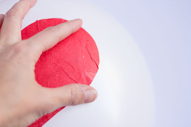 Make these DIY Valentine's Day heart balloons with Mod Podge and tissue paper!