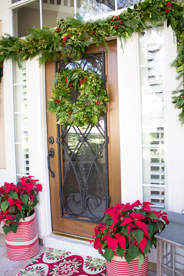 How to decorate your Christmas front porch with fresh greenery #christmasfrontporch #christmasporch #christmasdoor