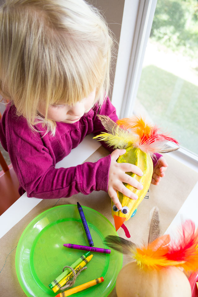 The Thanksgiving kids table with playful gourd turkeys and DIY turkey balloons! || http://www.designimprovised.com