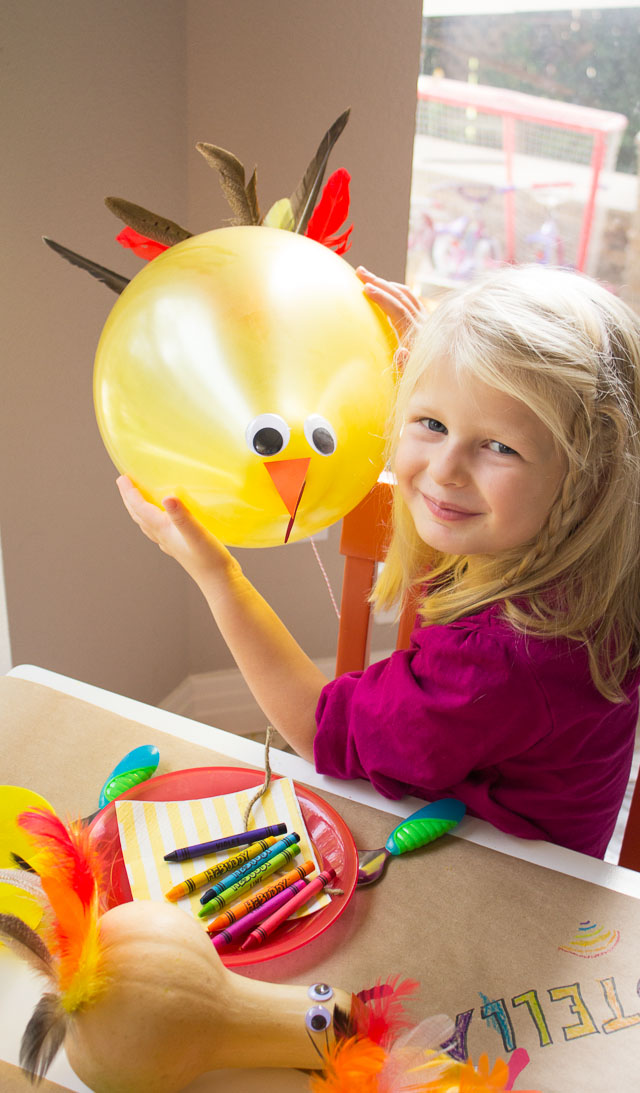 The Thanksgiving kids table with playful gourd turkeys and DIY turkey balloons! || http://www.designimprovised.com