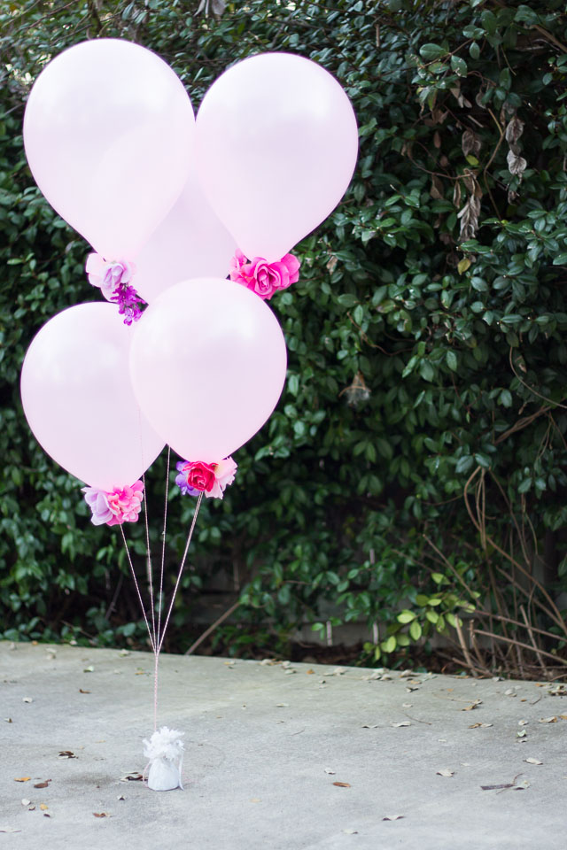 Combine artificial flowers with balloons for a gorgeous effect - perfect for weddings, showers, or a Valentine's Day bouquet! | http://www.designimprovised.com