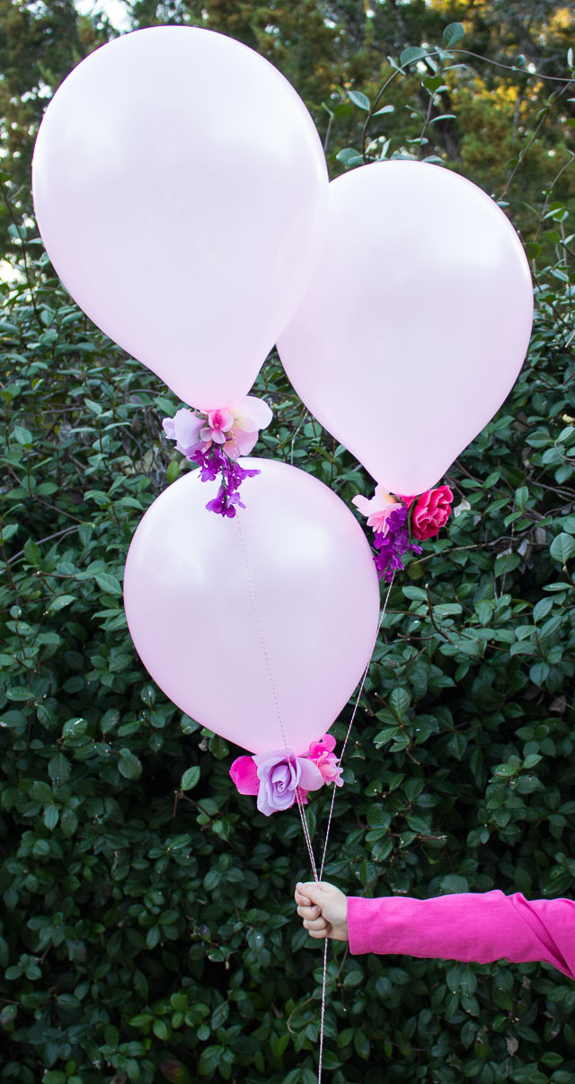 Combine artificial flowers with balloons for a gorgeous effect - perfect for weddings, showers, or a Valentine's Day bouquet! | http://www.designimprovised.com
