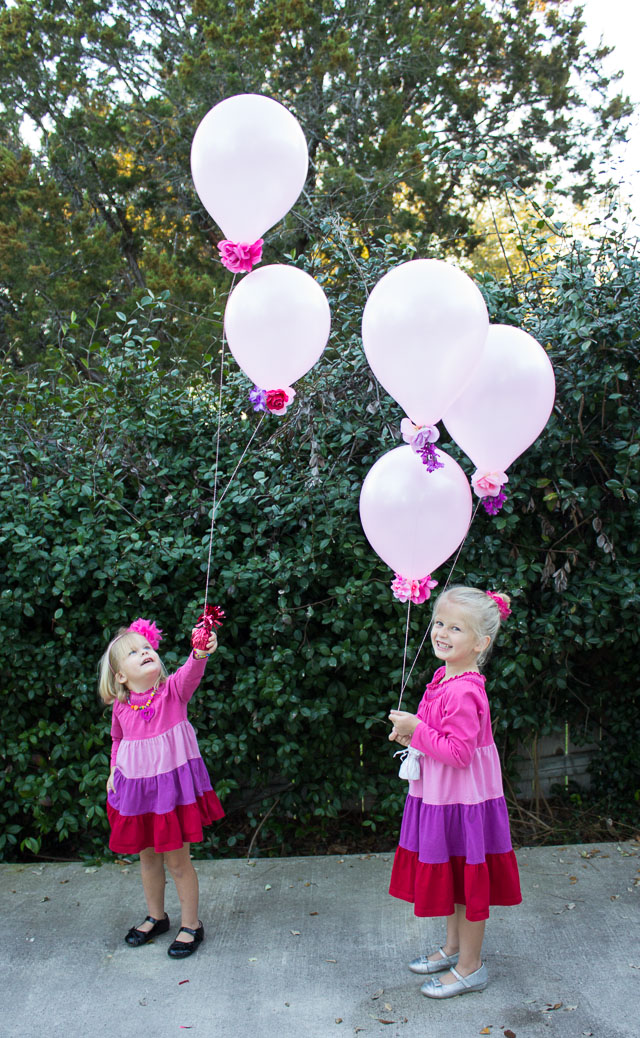 Combine artificial flowers with balloons for a gorgeous effect - perfect for weddings, showers, or a Valentine's Day bouquet! | http://www.designimprovised.com