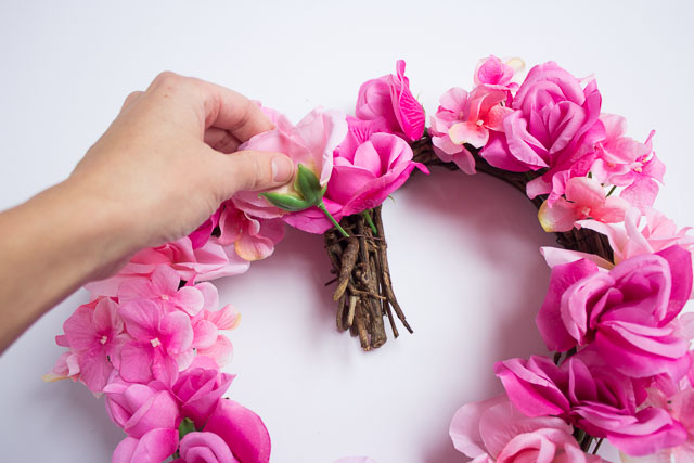 Make these beautiful floral hearts from dollar store flowers! | http://www.designimprovised.com