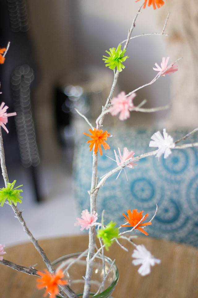 Make these flowering spring branches from party streamers! | http://www.designimprovised.com #12monthsofmartha