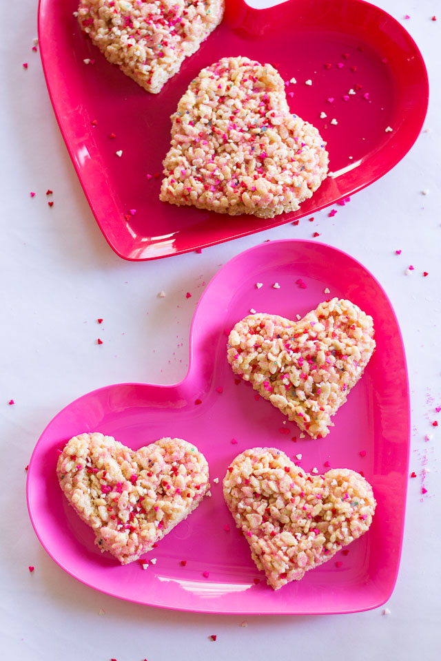 Rice Krispie Sprinkle Hearts - the perfect preschooler activity! Let them go nuts with sprinkles and then cut out with cookie cutters! | http://www.designimprovised.com