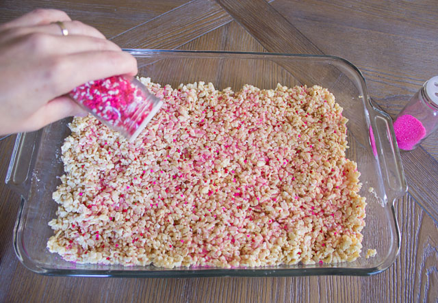 Rice Krispie Sprinkle Hearts - the perfect preschooler activity! Let them go nuts with sprinkles and then cut out with cookie cutters! | http://www.designimprovised.com