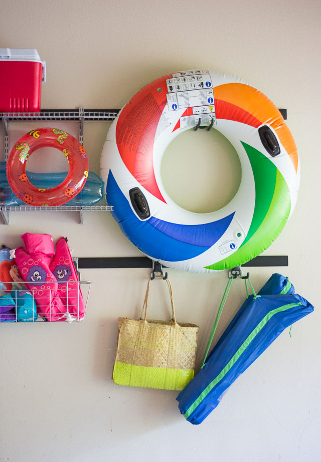 A great solution for organizing your pool gear in the garage! Garage organization with Rubbermaid FastTrack