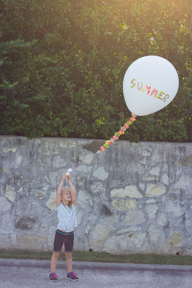 Decorate a balloon with cupcake liners - so fun!