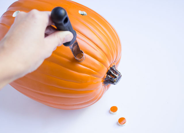 Use an apple corer to make holes in craft pumpkins!