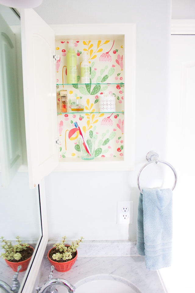 Makeover a medicine cabinet with peel and stick wallpaper!