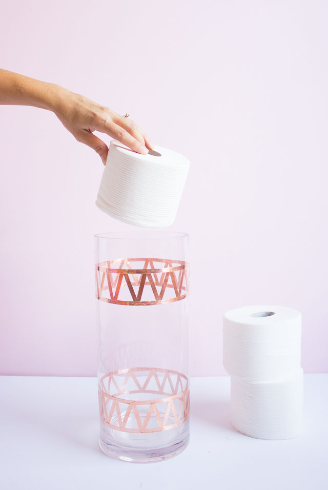 Transform an old vase into chic bath tissue storage! Transform an old vase into chic bath tissue storage!