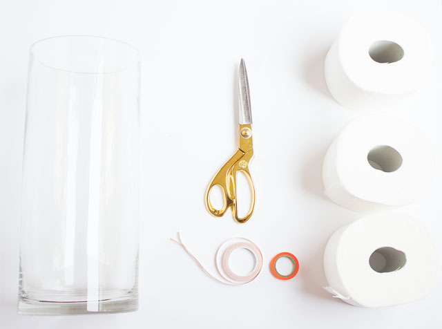 Transform an old vase into chic toilet paper storage!