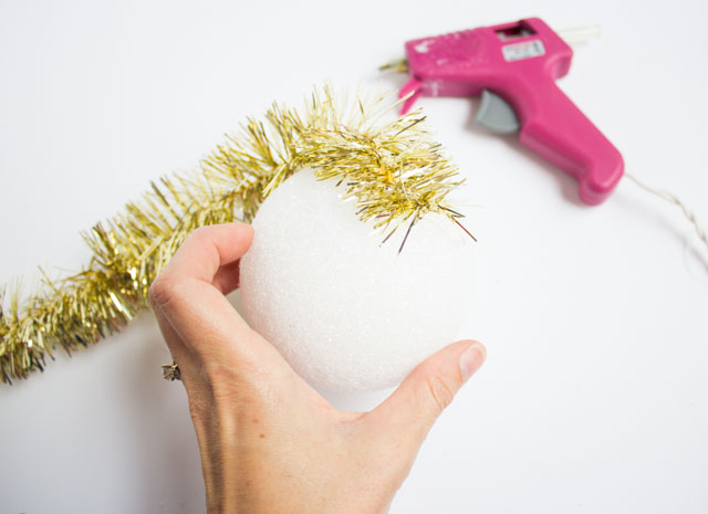 Homemade Christmas ornaments with tinsel garland