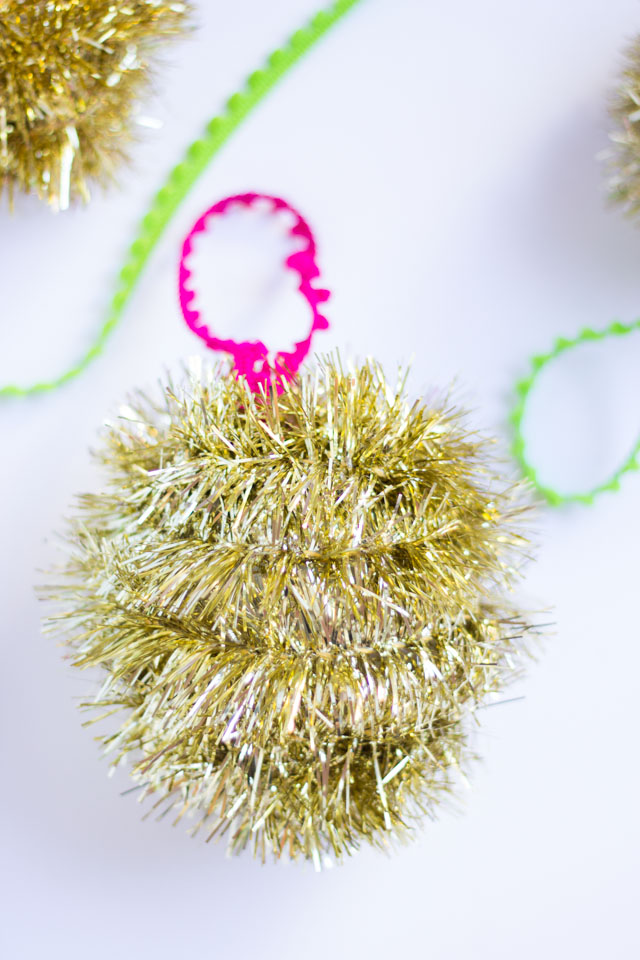 Homemade Christmas ornaments with tinsel garland
