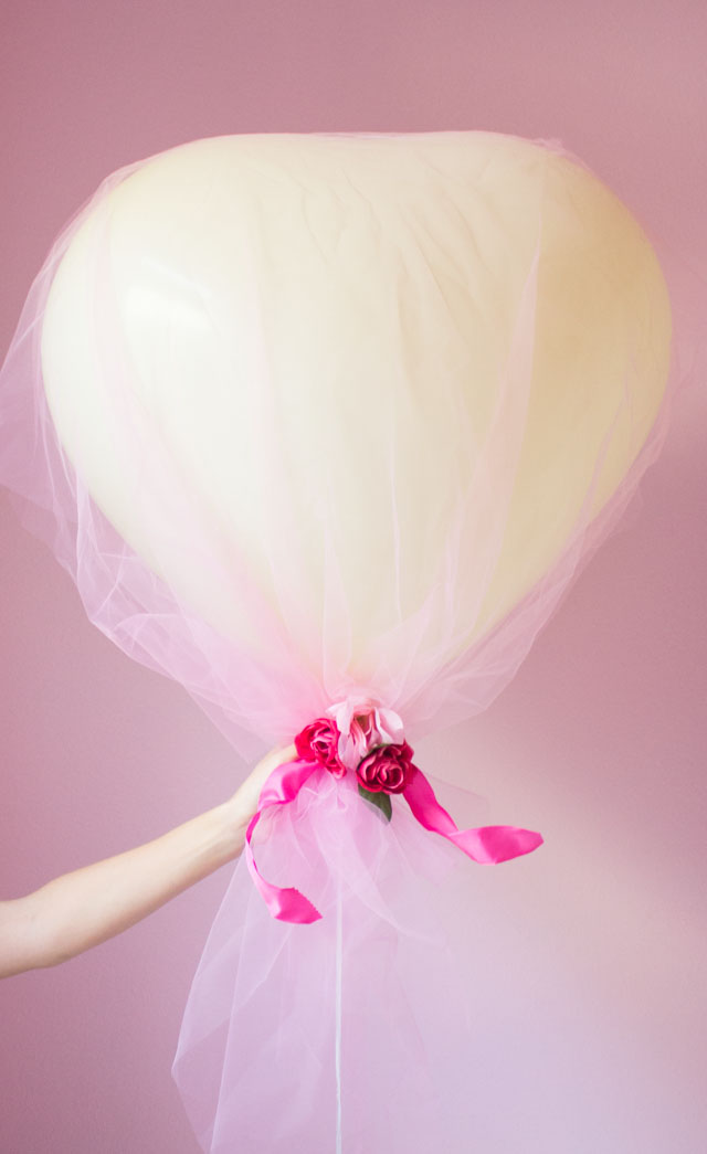 Cover giant heart balloons in tulle for a gorgeous effect!