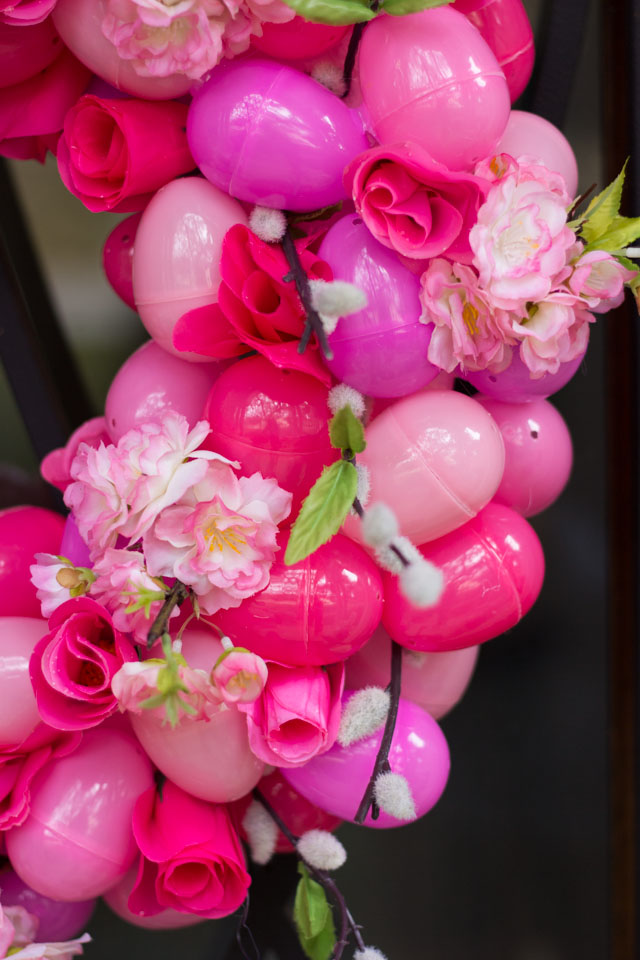 A beautiful DIY spring wreath idea made with plastic eggs and artificial flowers