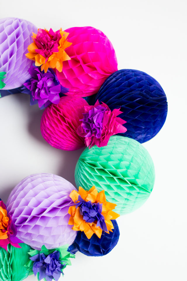 DIY fiesta wreath made with honeycomb balls and tissue paper flowers - so pretty!