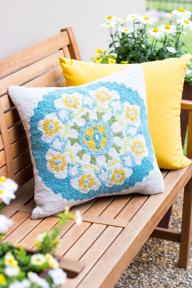 Love this hand-tufted outdoor pillow! The perfect cozy touch to a patio