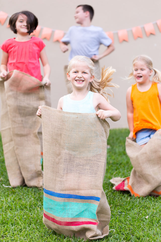 Have a backyard field day party with potato sack races!