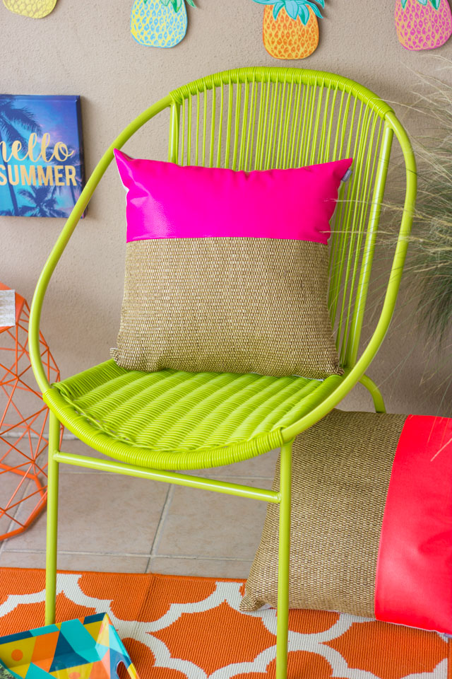 Love this bright green chair and hot pink pillow from At Home stores!