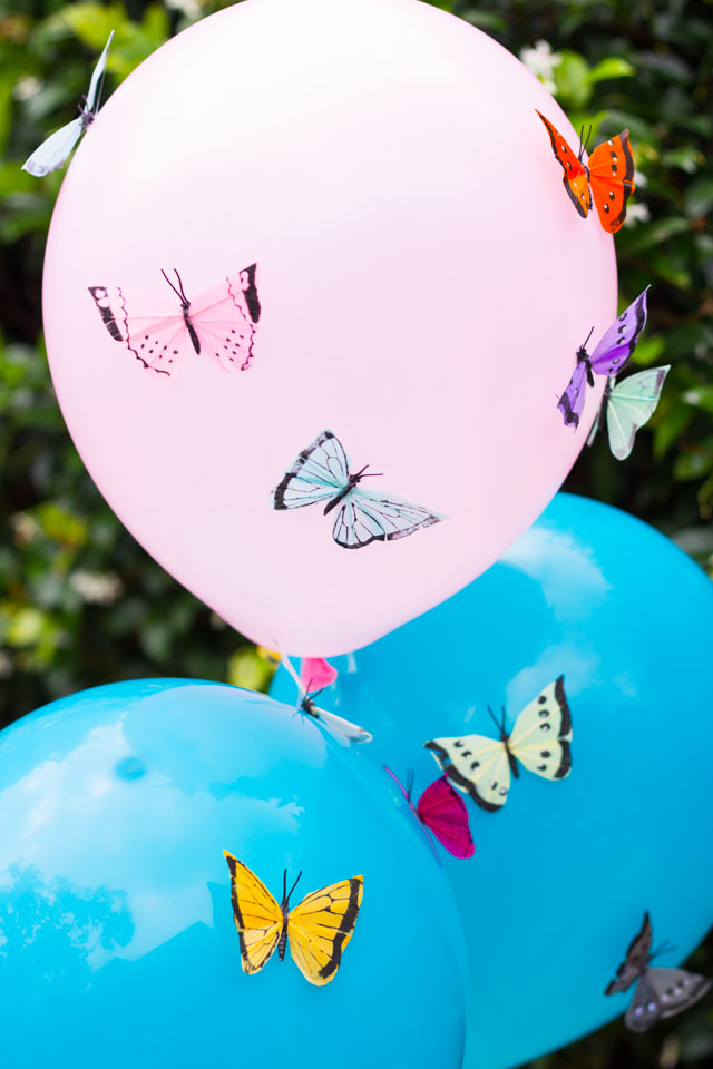 Add colorful feather butterflies to balloons for a gorgeous effect! Perfect for summer parties, shower, or wedding decor!