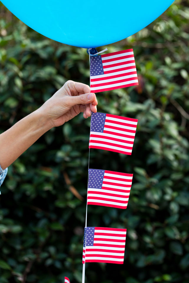 Decorate 4th of July balloons with small American flags!