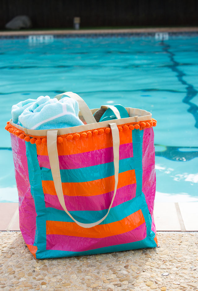 Transform an old shopping bag with duct tape to make the perfect pool bag!