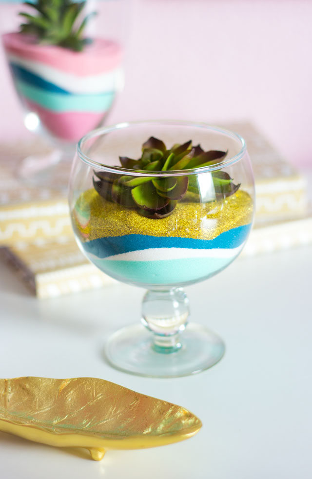 A fun sand art craft for adults - make pretty terrariums with colored sand and faux succulents!