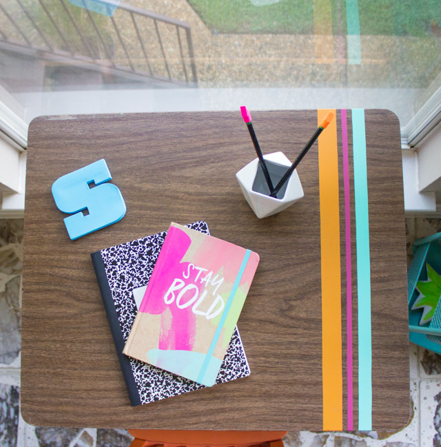 Love this vintage school desk decorated with strips of vinyl!