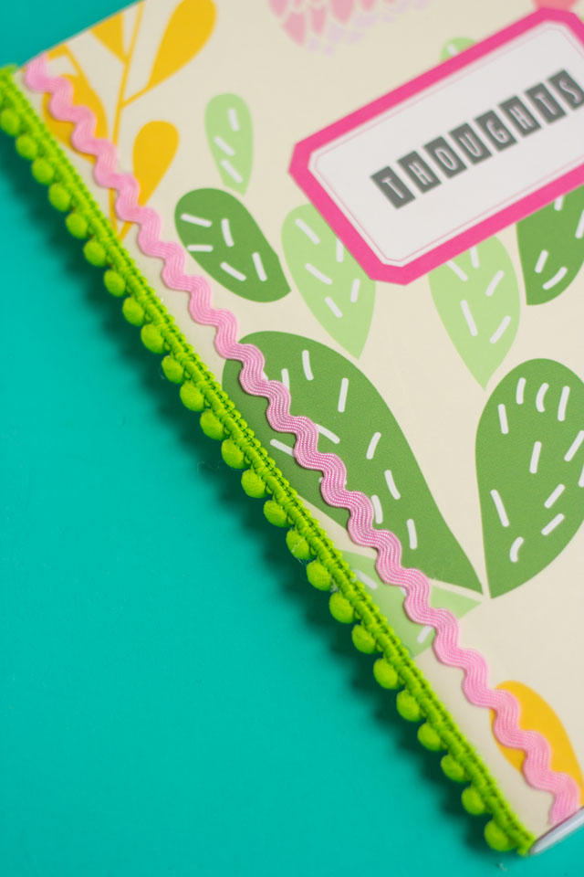 How to cover your notebooks with peel and stick vinyl and pom pom trim - so cute!