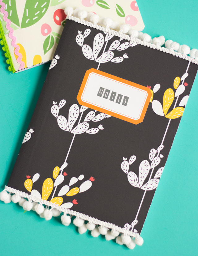 Vinyl covered notebooks with pom-pom trim