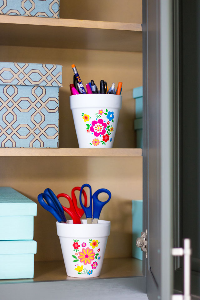 Use pretty flower pots to hold office supplies!