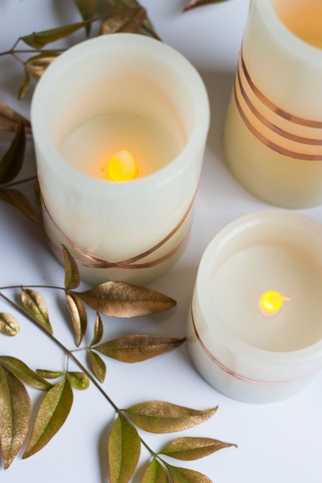 Wrap flameless LED candles with copper foil tape for a gorgeous look - perfect for fall or your Thanksgiving table!