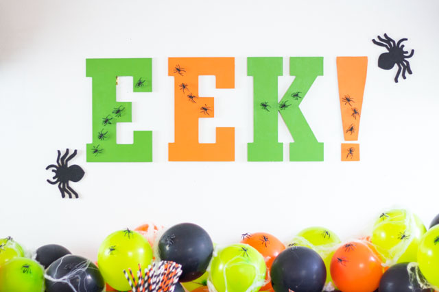 Make this EEK Halloween party sign for the perfect party backdrop!