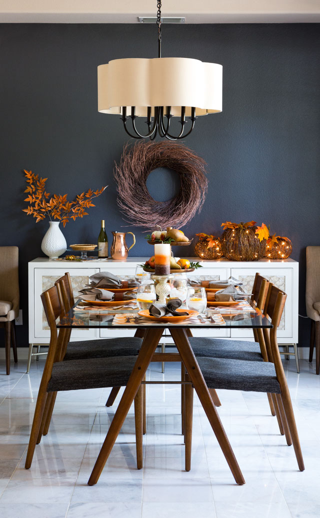 Love this moody fall dining room with harvest decor and metallic touches!