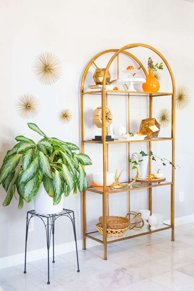 Love this gold etagere dining room storage! 