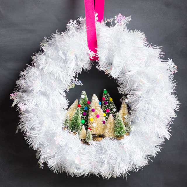 Make this gorgeous Christmas wreath in under 30 minutes with mini bottle brush trees!