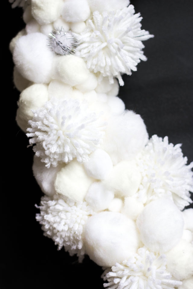Love this DIY white pom-pom wreath for winter!