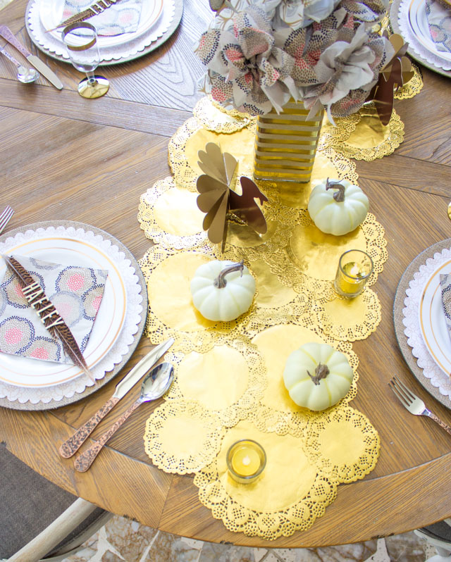 Make a beautiful DIY table runner out of gold doilies - so easy and inexpensive!
