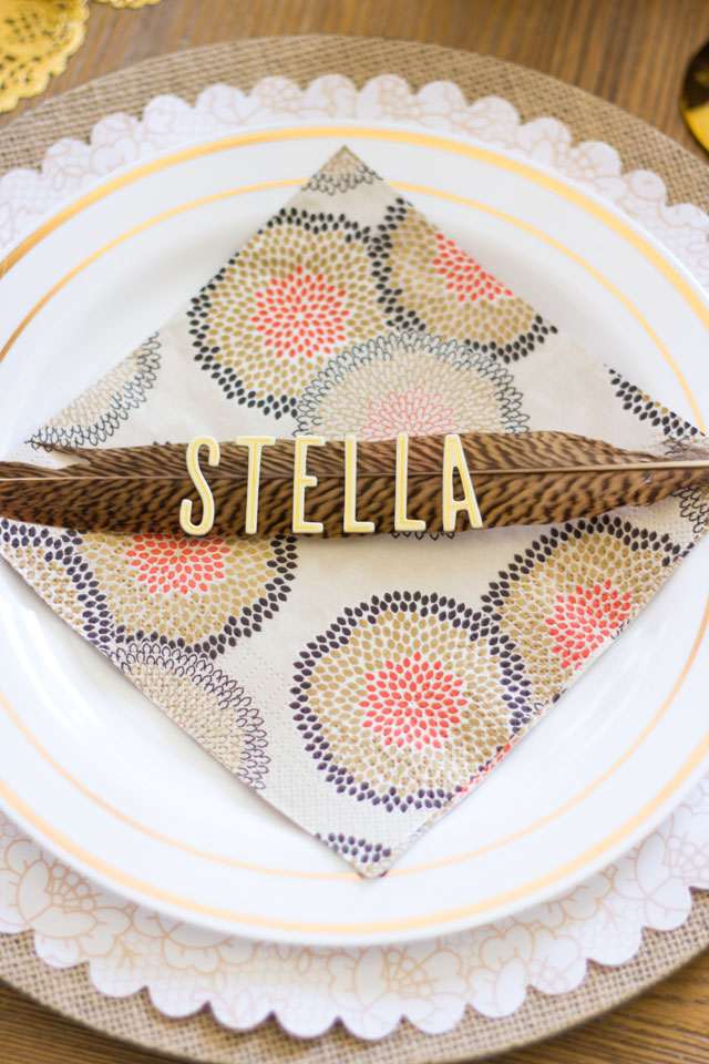 Create Thanksgiving place cards out of pheasant feathers and letter stickers - so easy!
