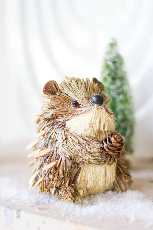 Mini hedgehog ornament in this winter woodland mantel!